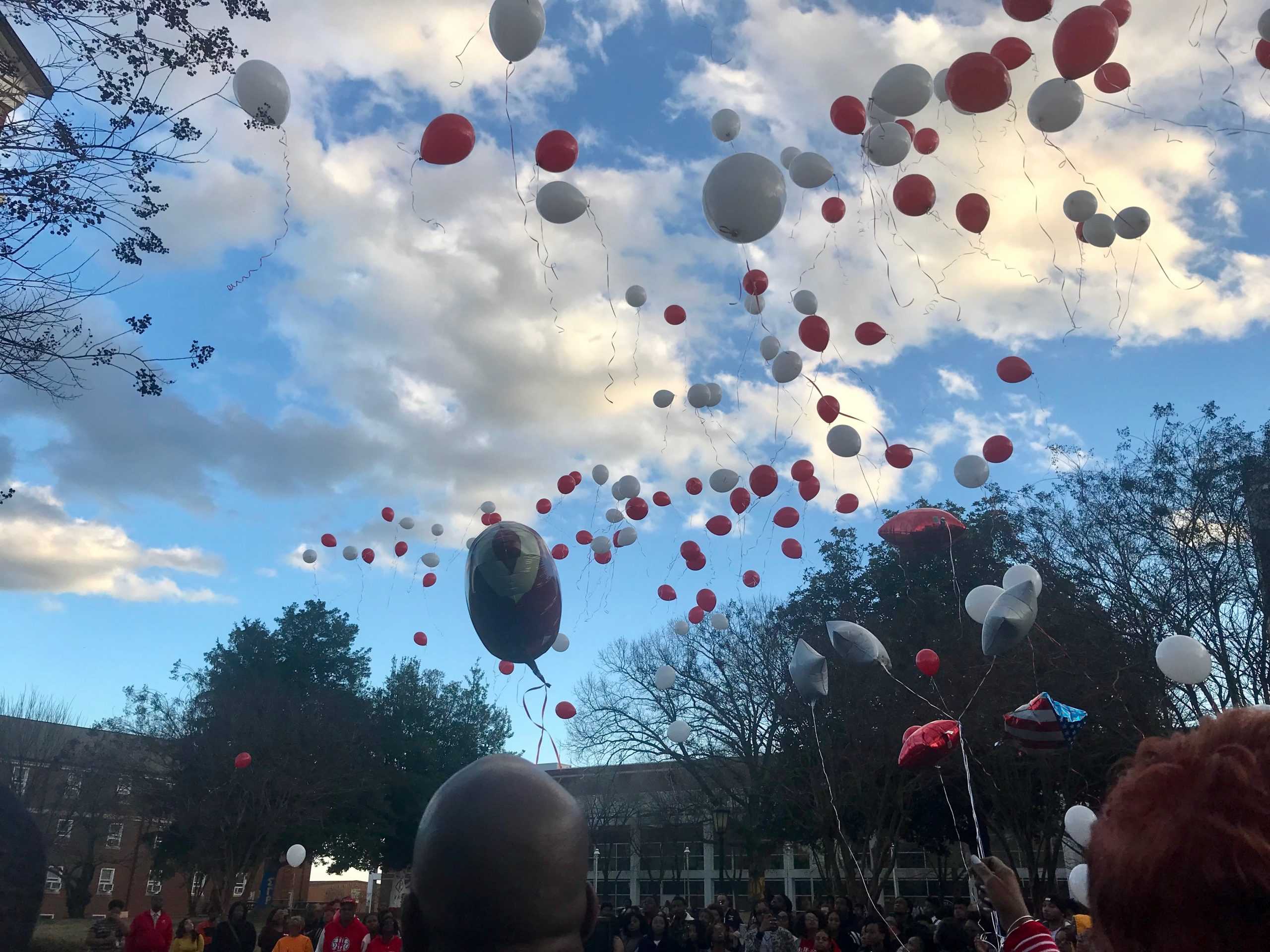 Red and White Balloons released at the vigil for Najee Ali Baker. 