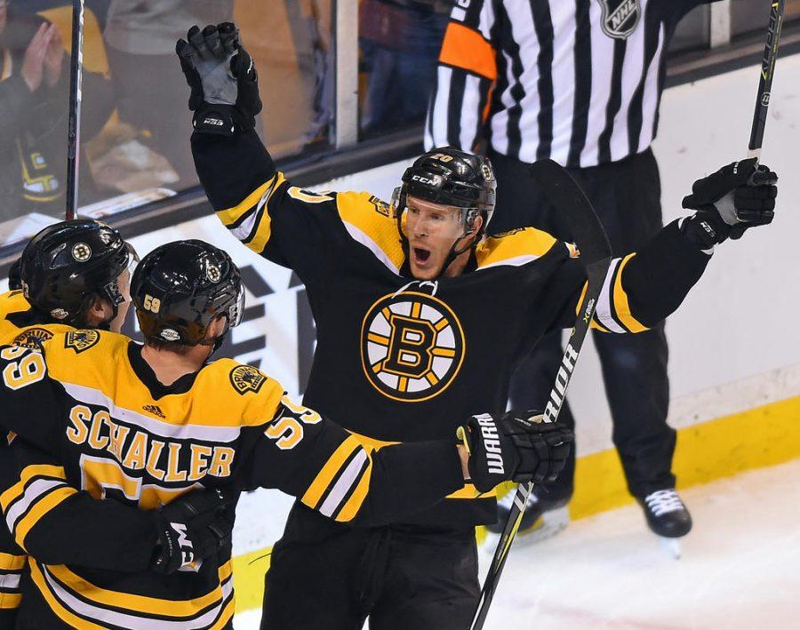 (Boston, MA, 02/13/18) Boston Bruins Riley Nash, right, is congratulated by teammates Charlie McAvoy, left, and Tim Schaller (59) after Nash scored against the Calgary Flames during the second period of an NHL hockey game at TD Garden in Boston on Tuesday, February 13, 2018. Staff photo by Christopher Evans