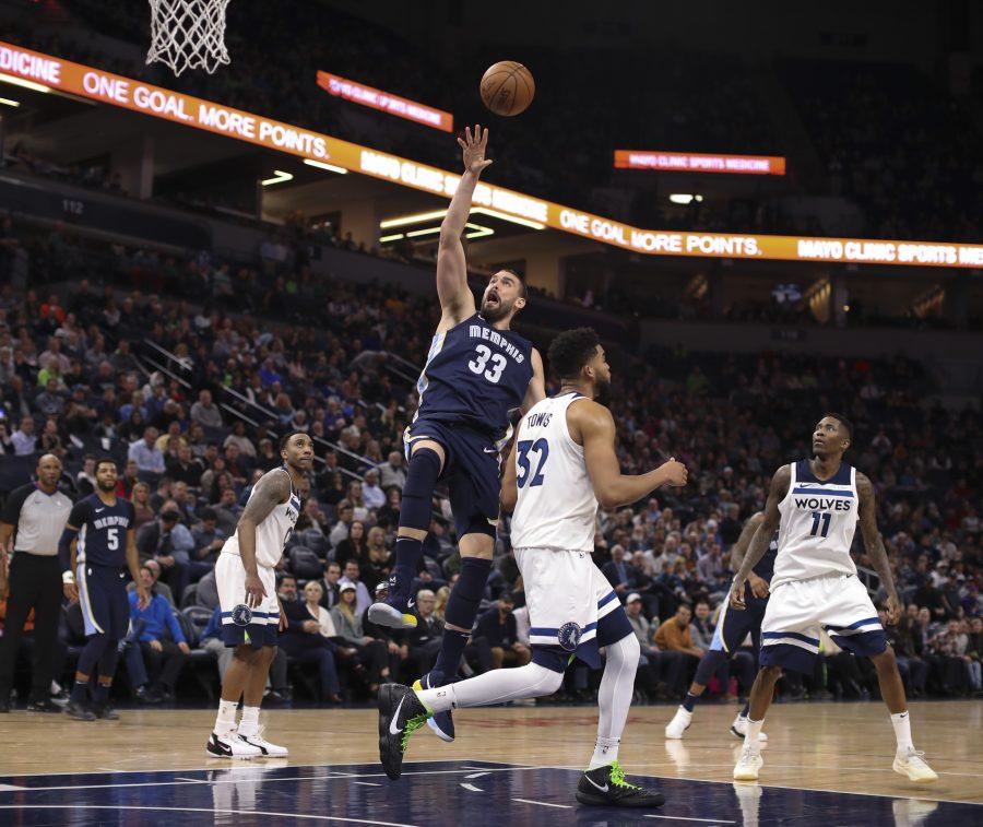 Memphis Grizzlies center Marc Gasol (33) shoots over Minnesota Timberwolves center Karl-Anthony Towns (32) late in the fourth quarter Monday, March 26, 2018 at the Target Center in Minneapolis, Minn. The Grizzlies won, 101-93. (Jeff Wheeler/Minneapolis Star Tribune/TNS)