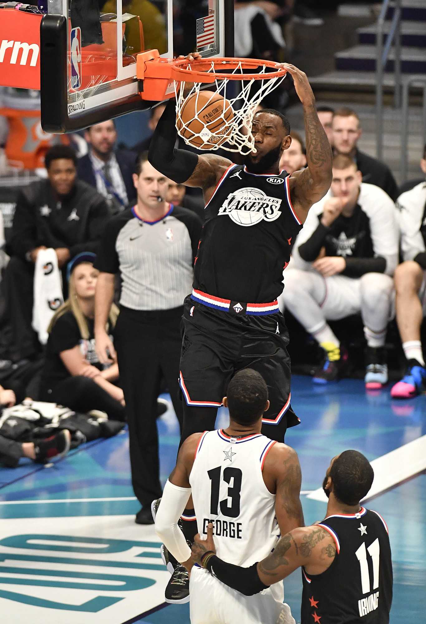 Team LeBrons LeBron James, of the Los Angeles Lakers, goes up for a dunk against Team Giannis Paul George, of the Oklahoma City Thunder, during the second half of the 2019 NBA All-Star 2019 game at Spectrum Center in Charlotte, N.C. on Sunday, February 17, 2019. (David T. Foster III/Charlotte Observer/TNS)
