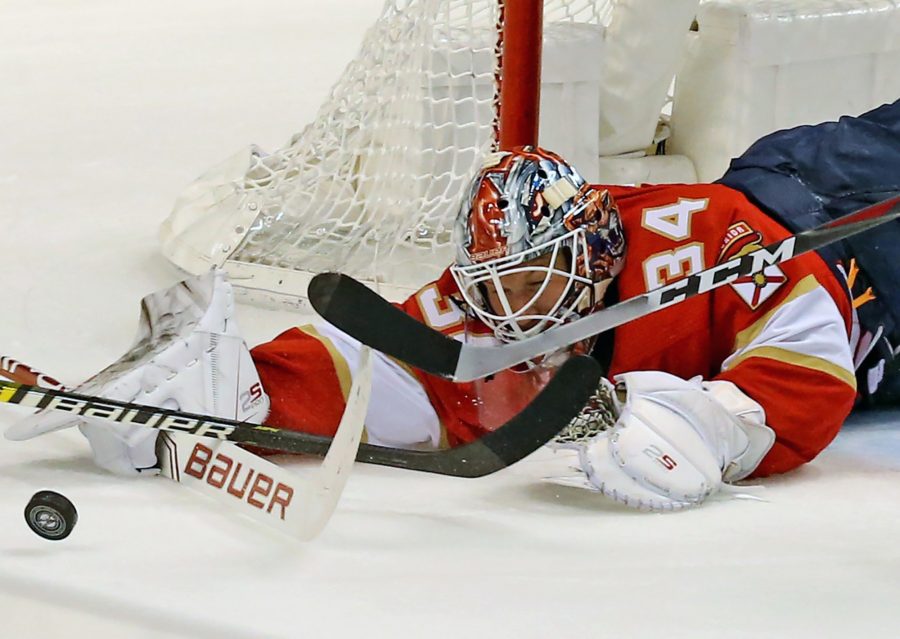 Florida Panthers goaltender James Reimer (34) fights the puck against the Buffalo Sabres at the BB&T Center in Sunrise, Fla., on Tuesday, Feb., 19, 2019. The Panthers won, 4-2. (Charles Trainor Jr./Miami Herald/TNS)