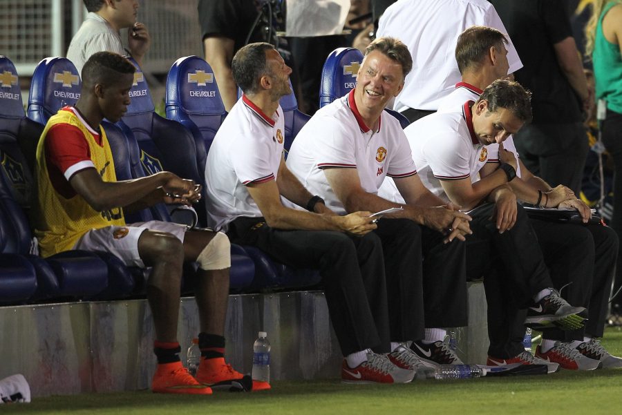 Manchester United coach Louis van Gaal, smiling, sits on the bench during an exhibition game against the Los Angeles Galaxy at the Rose Bowl in Pasadena, Calif., on Wednesday, July 23, 2014. Manchester won, 7-0. (Rick Loomis/Los Angeles Times/MCT)