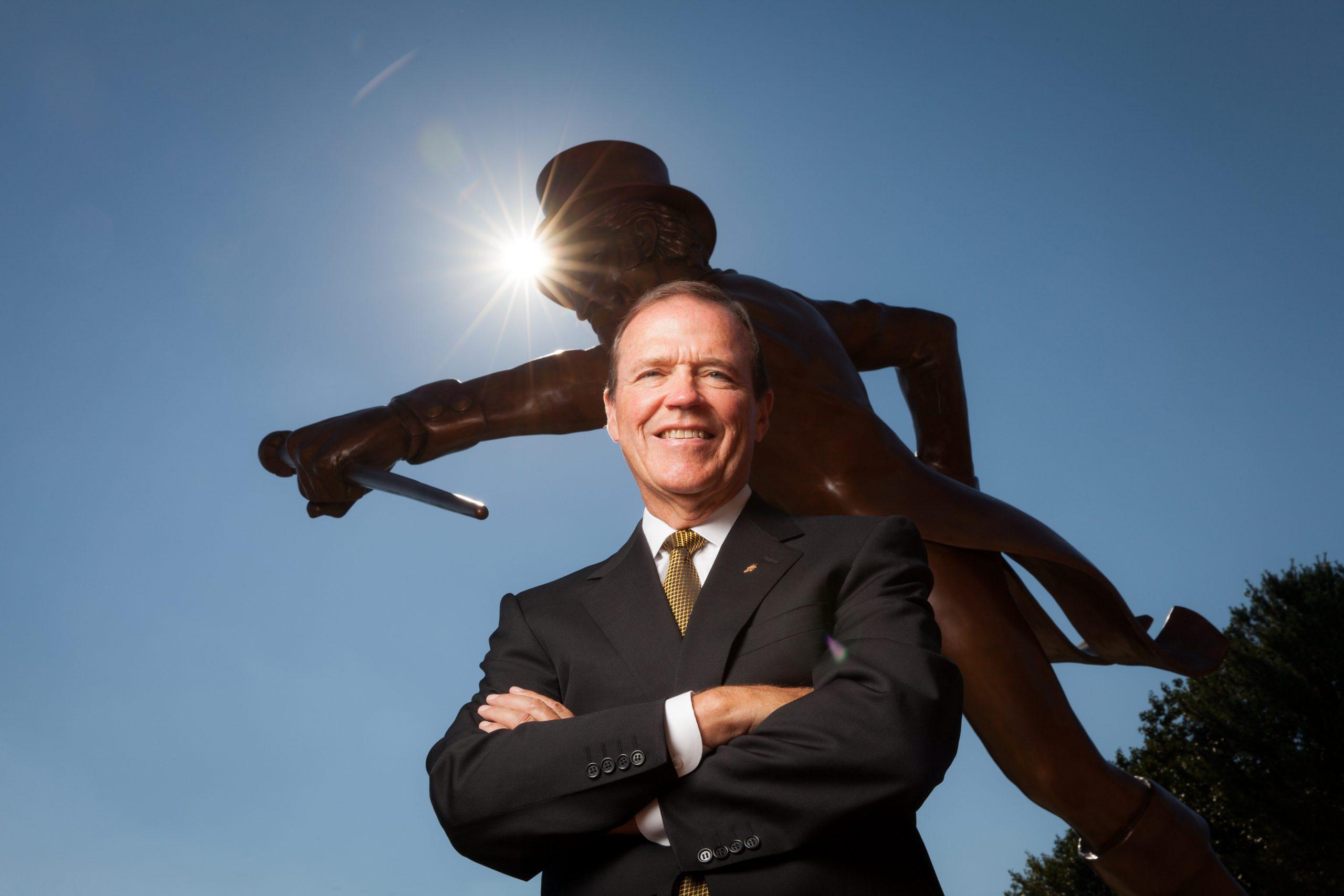 Wake Forest Athletics Director Ron Wellman poses for a portrait in front of the Demon Deacon statue at Deacon Tower on Wednesday, September 4, 2013.
