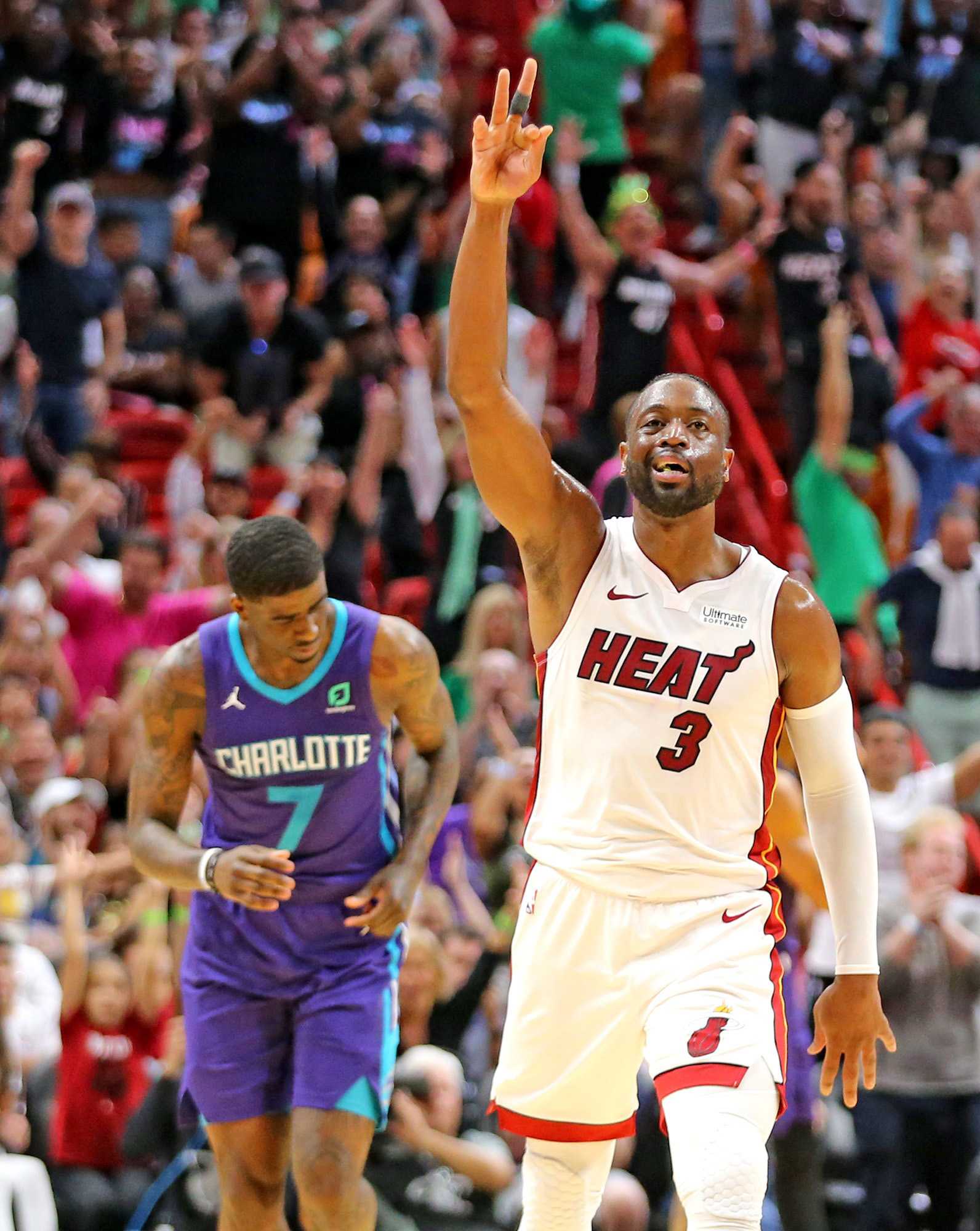 Miami Heats Dwayne Wade signals his three-pointer in the fourth quarter against the Charlotte Hornets on Sunday, March, 17, 2019 at the AmericanAirlines Arena in Miami, Fla. (Charles Trainor Jr./Miami Herald/TNS)