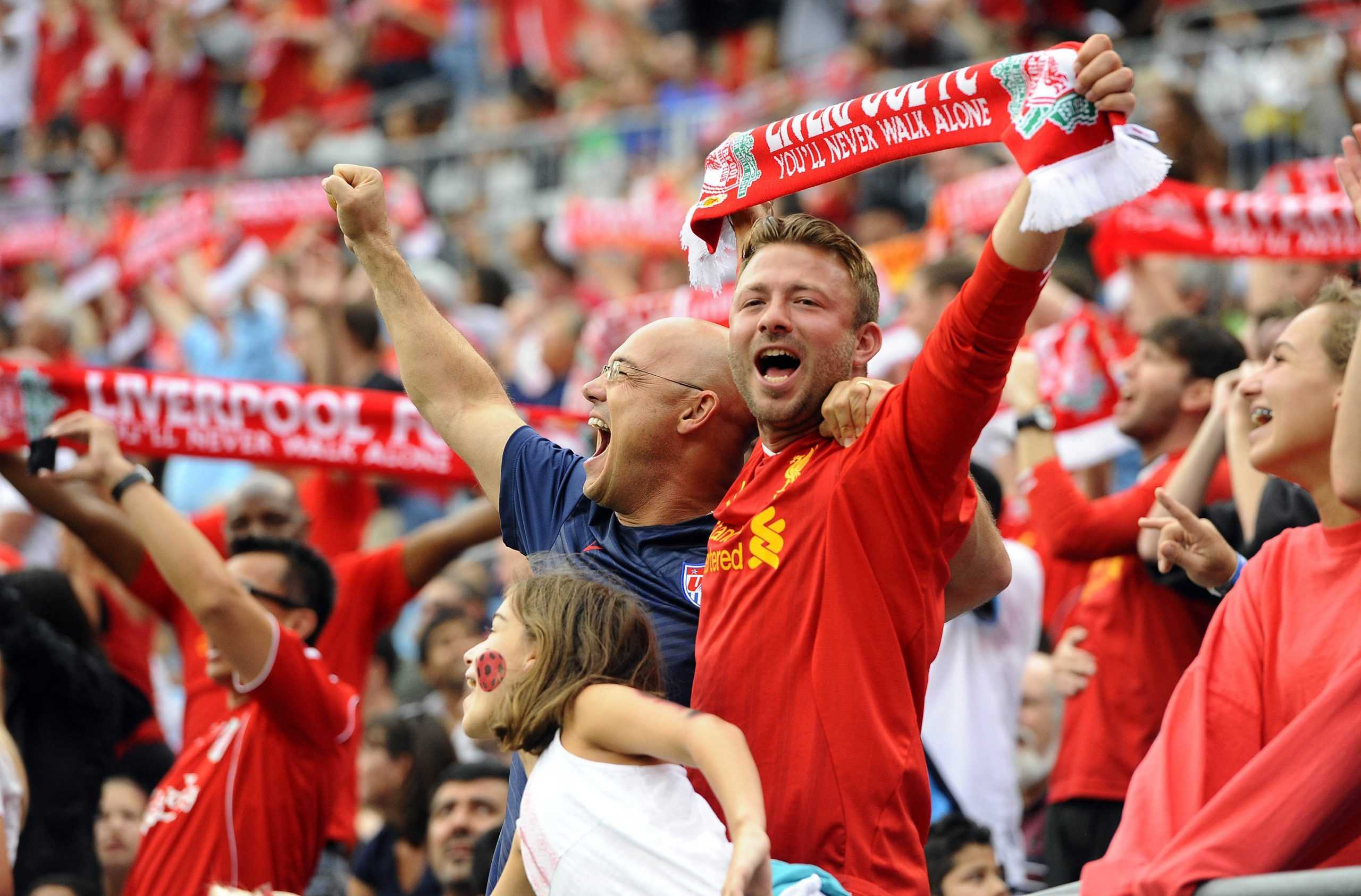 Liverpool fans stand and cheer during action against AC Milan in the semifinals of the International Champions Cup at Bank of America Stadium in Charlotte, N.C., on Saturday, Aug. 2, 2014. Liverpool won, 2-0. (David T. Foster, III/Charlotte Observer/MCT)
