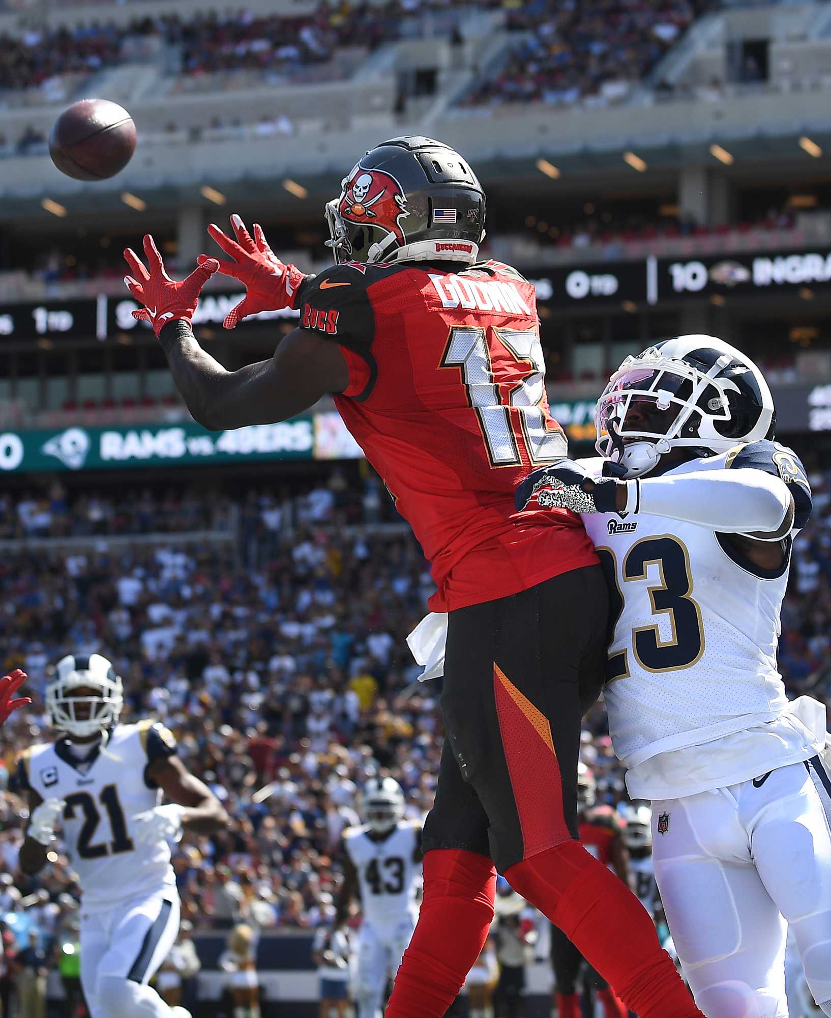 Tampa Bay Buccaneers wide receiver Chris Godwin (12) catches a touchdown pass in front of Los Angeles Rams corneback Nickell Robey-Coleman in the second quarter at the Los Angeles Coliseum on Sunday, Sept. 29, 2019, in Los Angeles. The Buccaneers won, 55-40. (Wally Skalij/Los Angeles Times/TNS)