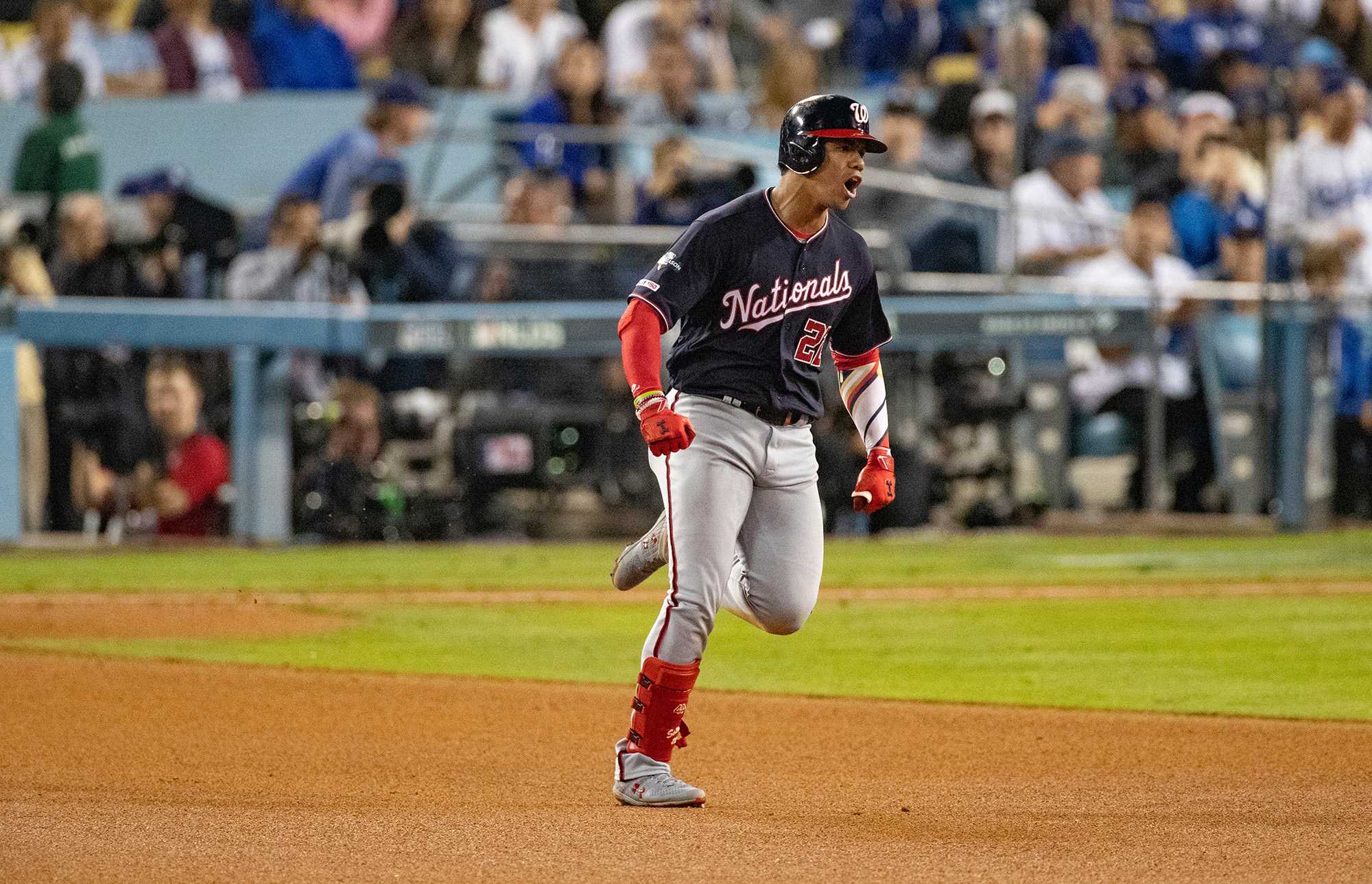 The Washington Nationals Juan Soto (22) celebrates as he runs the bases after hitting the game-tying home run against the Los Angeles Dodgers in the eighth inning during Game 5 of the National League Division Series at Dodger Stadium in Los Angeles on Wednesday, Oct. 9, 2019. (Gina Ferazzi/Los Angeles Times/TNS)