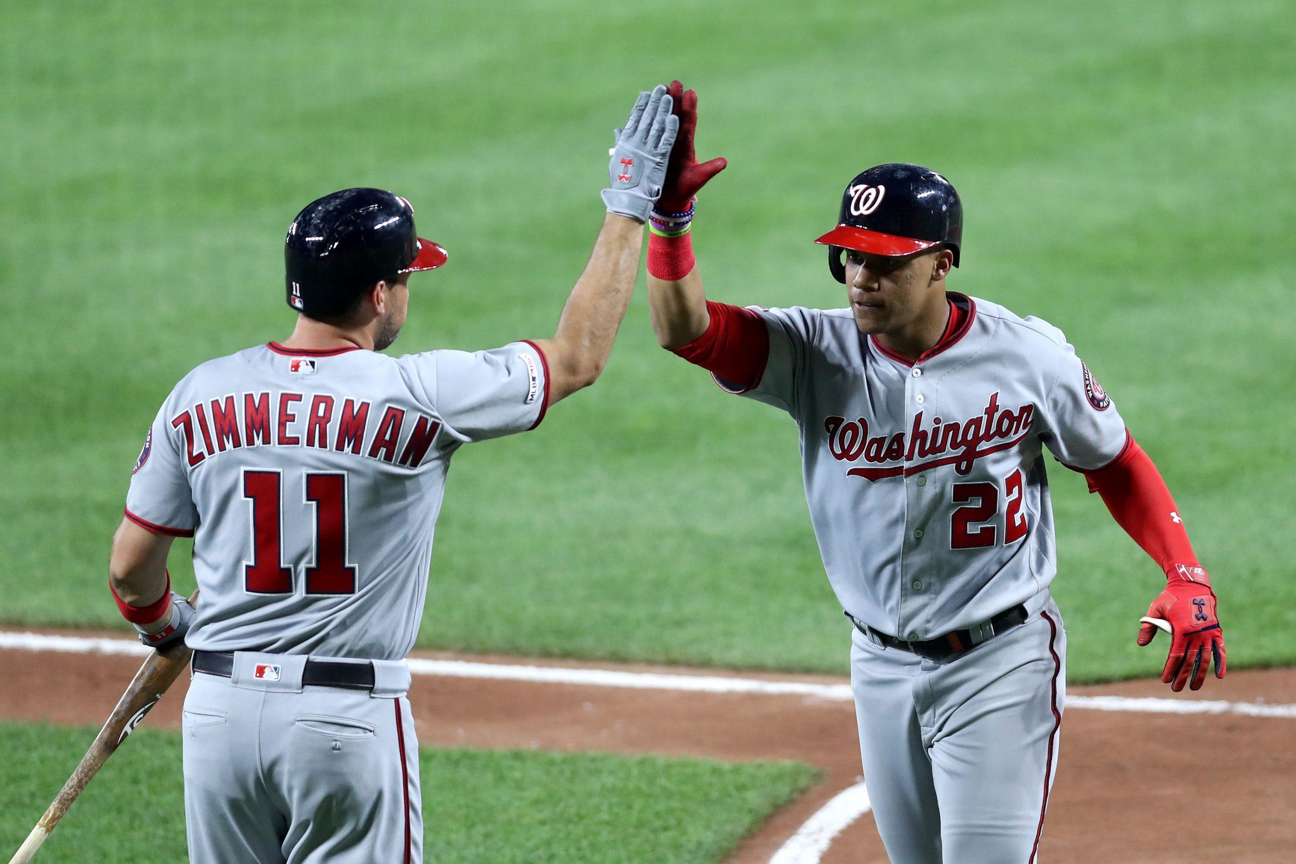 Juan Soto #22 of the Washington Nationals celebrates with Ryan Zimmerman #11 after hitting a solo home run in the sixth inning against the Baltimore Orioles at Oriole Park at Camden Yards on July 16, 2019 in Baltimore, Maryland. (Rob Carr/Getty Images/TNS) **FOR USE WITH THIS STORY ONLY**