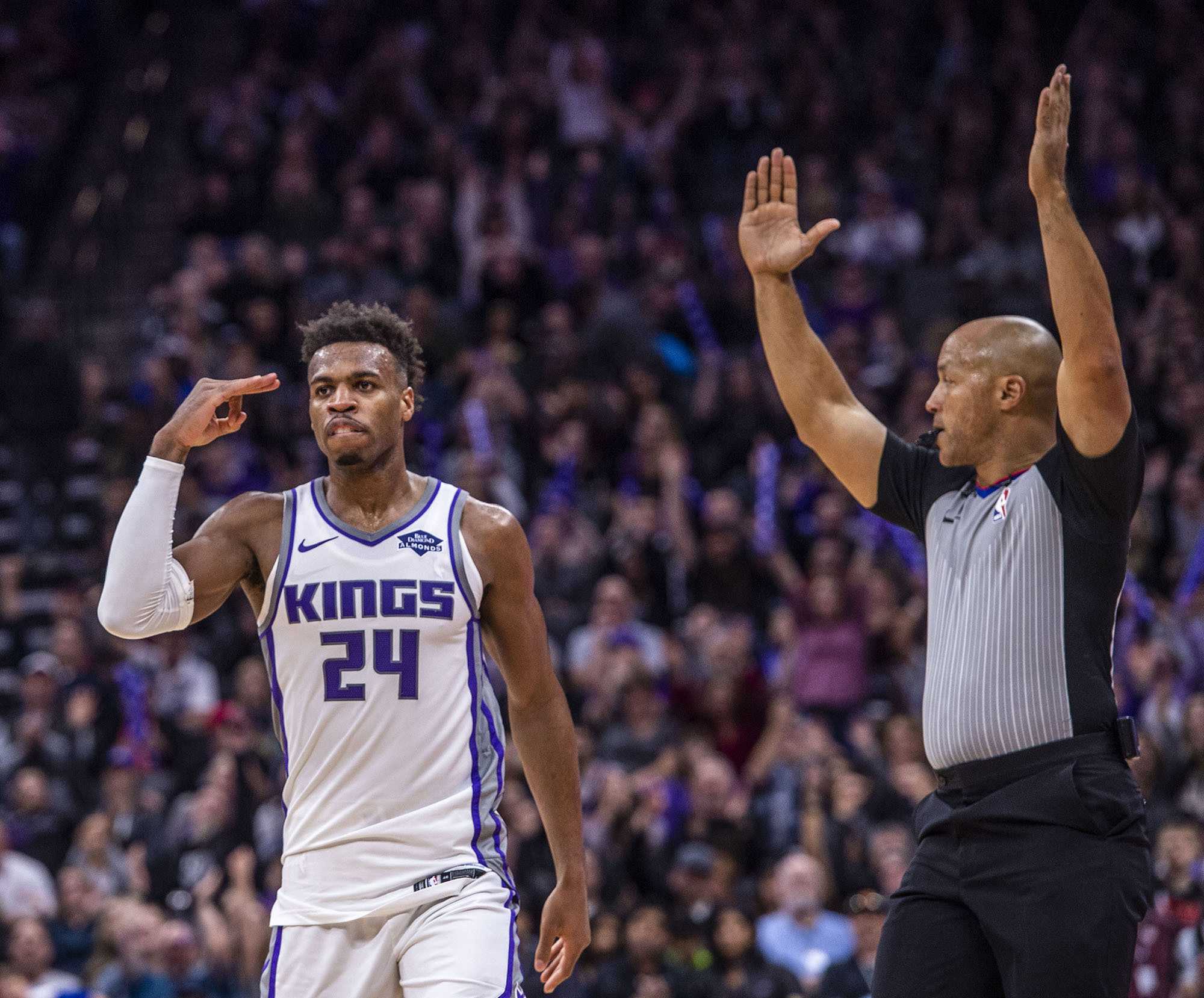 The Sacramento Kings Buddy Hield (24) celebrates a three-point basket as referee Marc Davis signals the play against the Phoenix Suns on March 23, 2019, at the Golden 1 Center in Sacramento, Calif. (Hector Amezcua/Sacramento Bee/TNS)