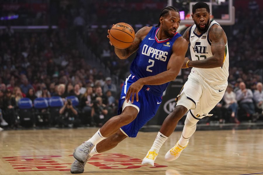 Los Angeles Clippers forward Kawhi Leonard (2) drives to the basket while being chased by Utah Jazz forward Royce O'Neale (23) on Sunday, Nov. 3, 2019 at Staples Center in Los Angeles, Calif. (Kent Nishimura/Los Angeles Times/TNS)