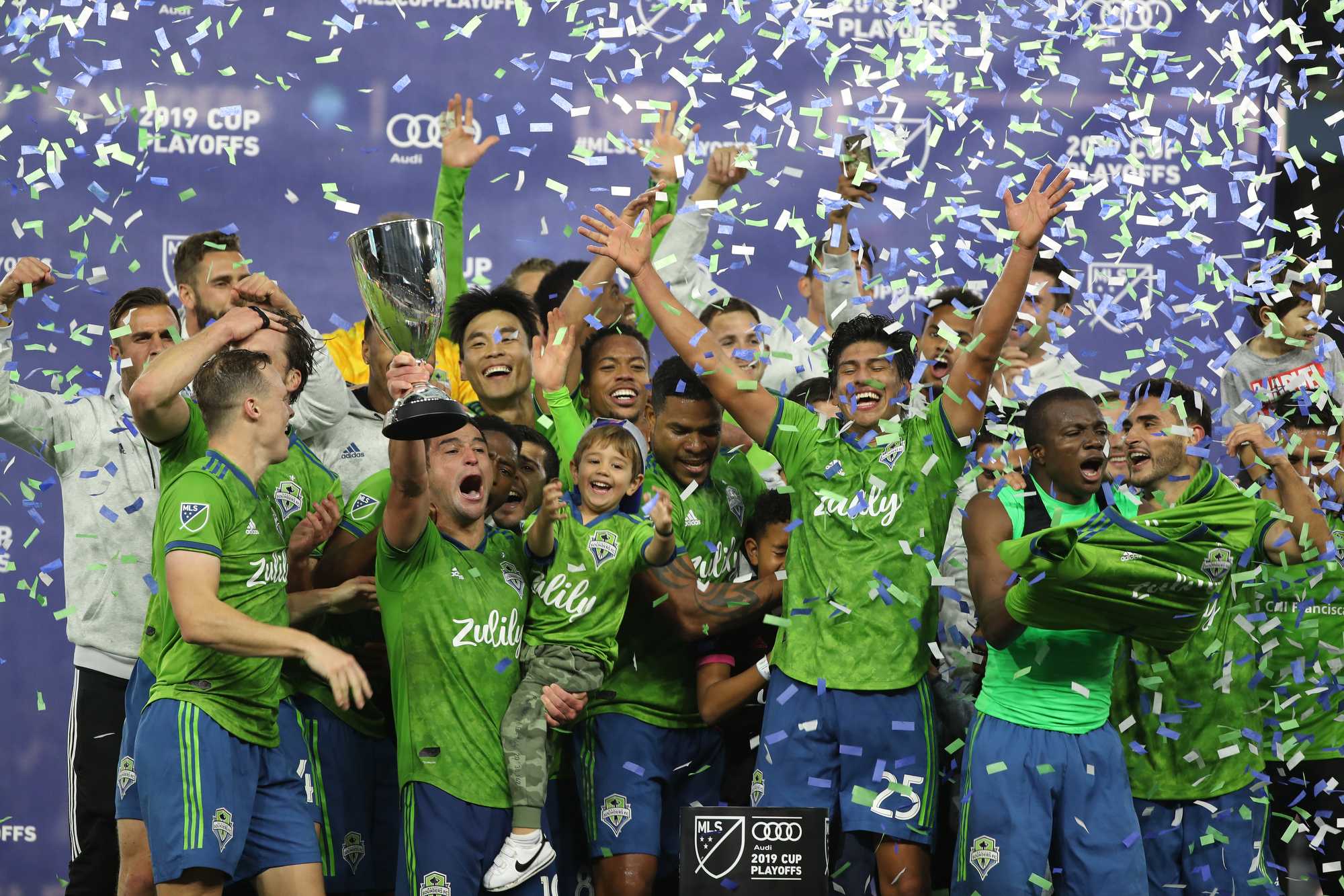 LOS ANGELES, CALIF. -- TUESDAY, OCTOBER 29, 2019: Seattle Sounders Football Club midfielder hoists the trophy as the team celebrate their 3-1 playoff win over Los Angeles Football Club at Banc of California in Los Angeles, Calif., on Oct. 29, 2019. (Allen J. Schaben / Los Angeles Times)