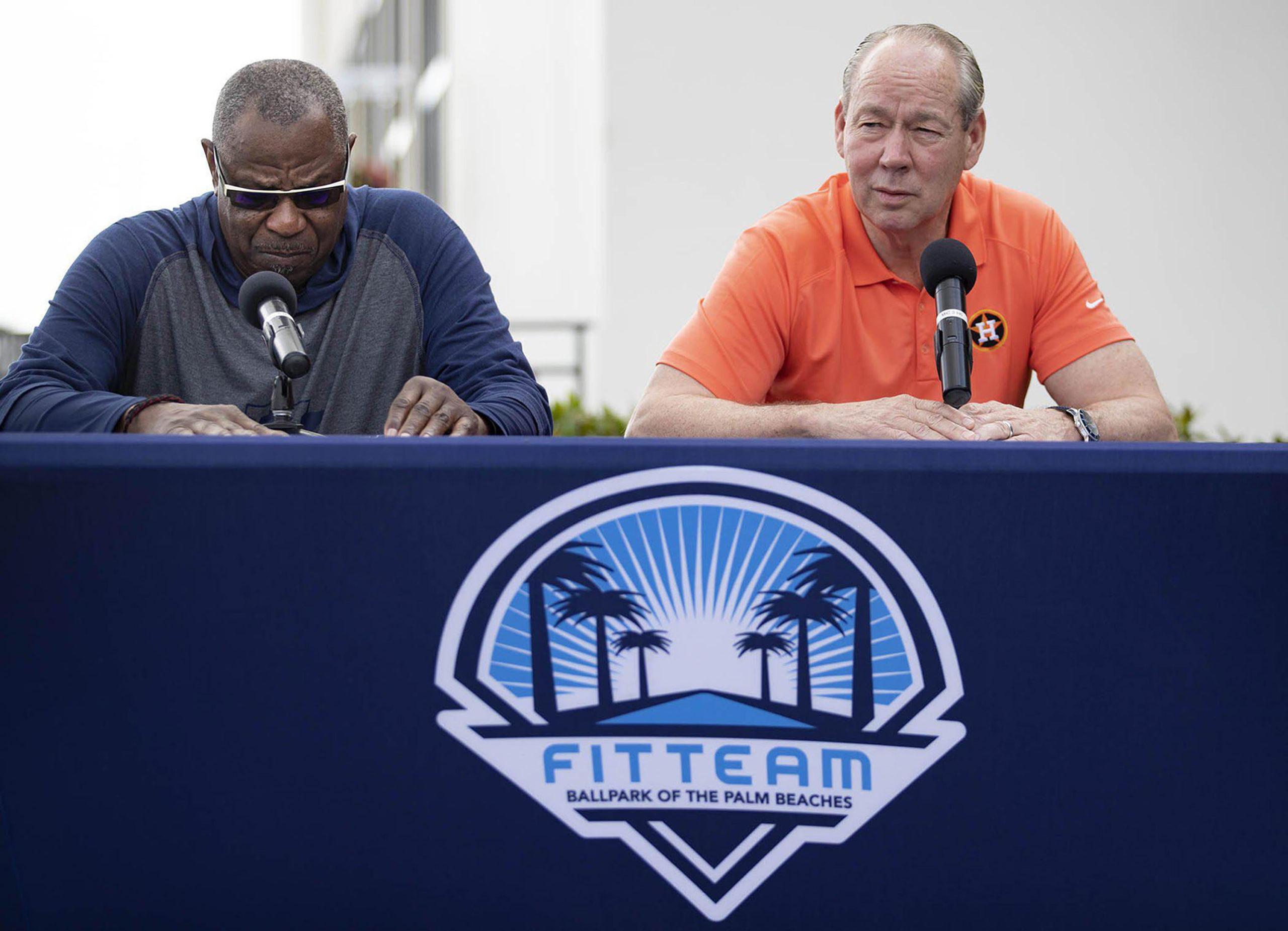 Houston Astros manager Dusty Baker, left, listens as team owner Jim Crane talks during a news conference before the start of spring training at Fitteam Ballpark of the Palm Beaches in West Palm Beach, Fla., on Thursday, Feb. 13, 2020. (Allen Eyestone/Palm Beach Post/TNS)