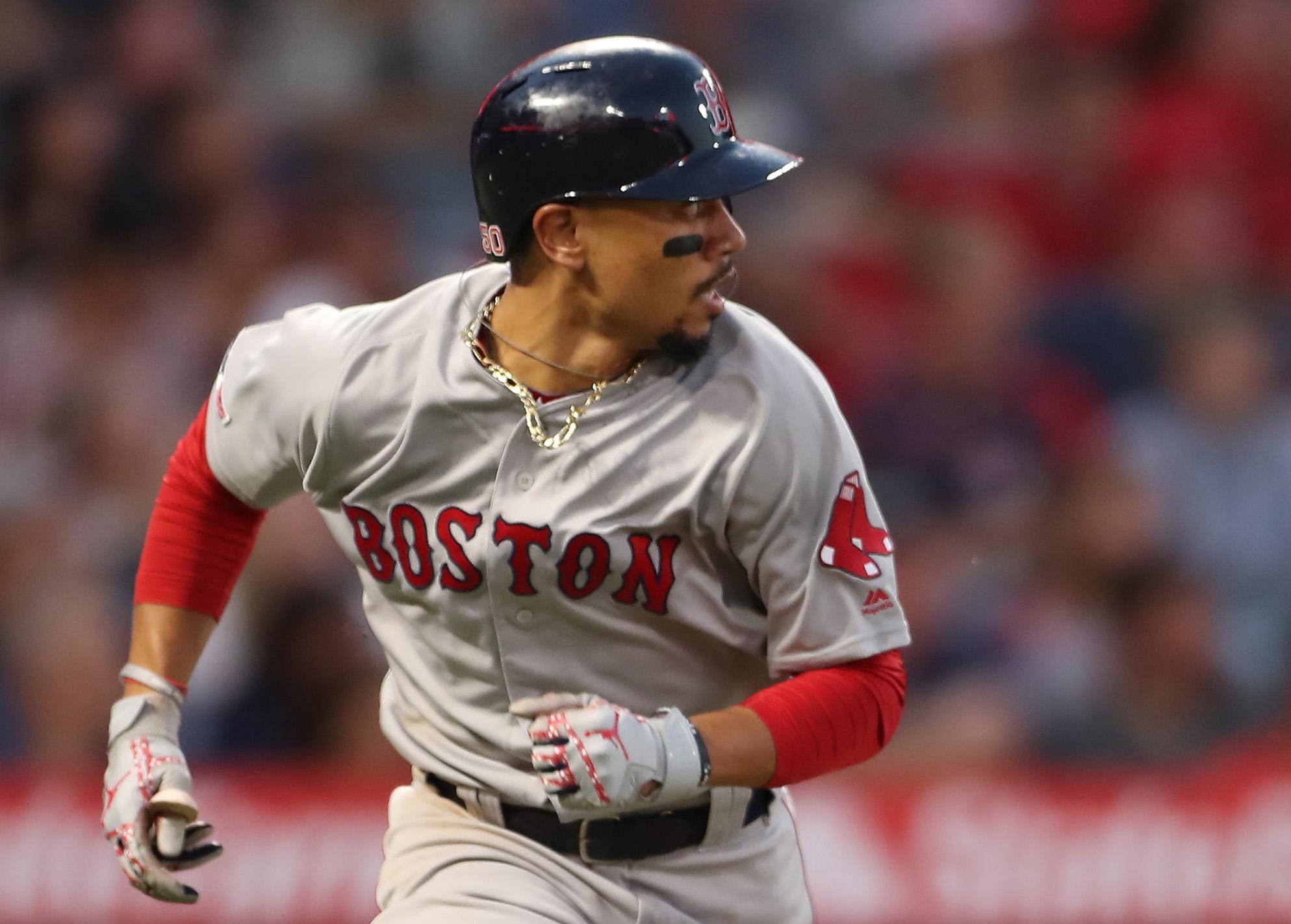 Boston Red Sox right fielder Mookie Betts (50) runs to first as he watches his hit during the game between the Boston Red Sox and the Los Angeles Angels at Angel Stadium on Aug. 31, 2019 in Anaheim, Calif. (Peter Joneleit/CSM/Zuma Press/TNS)