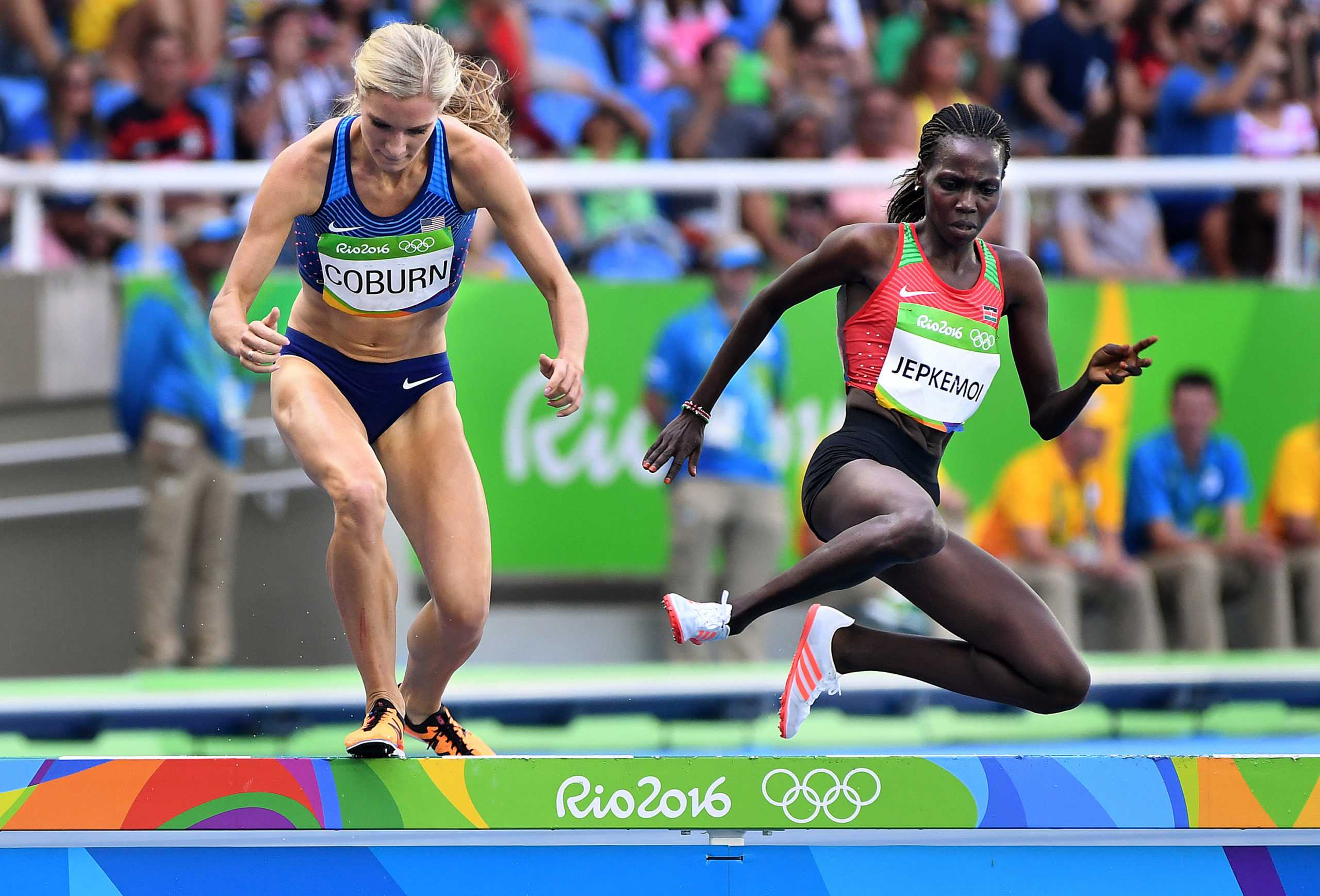 Emma Coburn, left, of the U.S. battles Kenyas Hyvin Kiyeng Jepkemoi for the silver and bronze medal on the last lap of the 3,000-meter steeplechase on Monday, Aug. 15, 2016 at the Rio 2016 Olympics in Brazil. (Wally Skalij/Los Angeles Times/TNS)