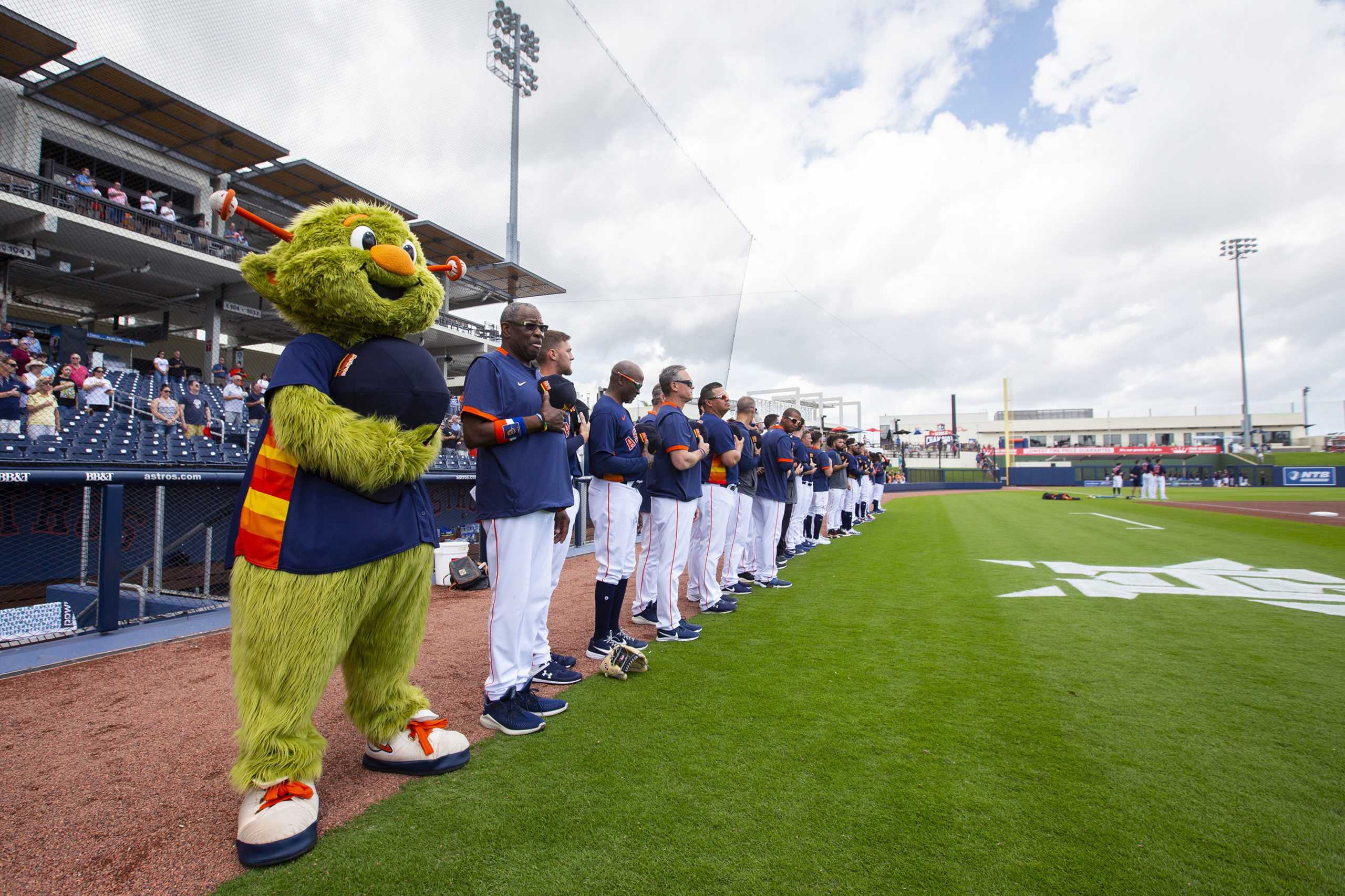 The Houston Astros baseball team line up for the national anthem ahead of a spring training game against the Miami Marlins at FITTEAM Ballpark of the Palm Beaches Tuesday, Feb. 25, 2020 in West Palm Beach, Fla. (Daniel A. Varela/Miami Herald/TNS)