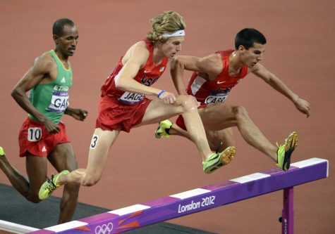 Donn Cabral of Glastonbury, right, competes in the 3,000-meter steeplechase at the London Olympics in 2012.