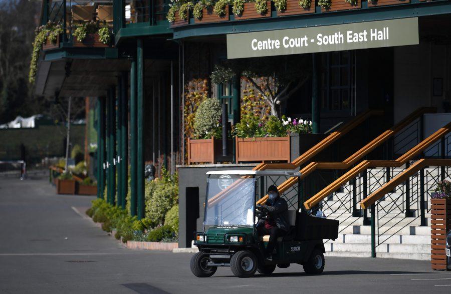 LONDON, ENGLAND - APRIL 01:  A member of staff works outside Centre Court at The All England Tennis and Croquet Club, best known as the venue for the Wimbledon Tennis Championships, on April 01, 2020 in London, England. The Coronavirus (COVID-19) pandemic has spread to many countries across the world, claiming over 40,000 lives and infecting hundreds of thousands more. (Alex Davidson/Getty Images/TNS)