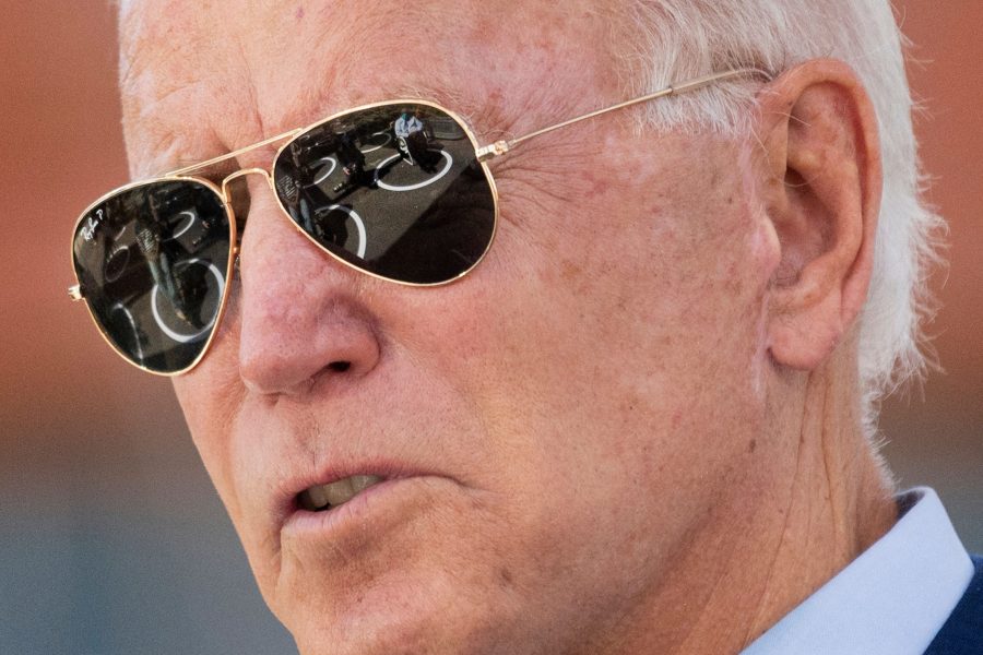 Socially distanced attendees are reflected in Democratic presidential candidate Joe Bidens sunglasses as he speaks at the Black Economic Summit at Camp North End in Charlotte, North Carolina, on Wednesday, Sept. 23, 2020. (Jim Watson/AFP/Getty Images/TNS)