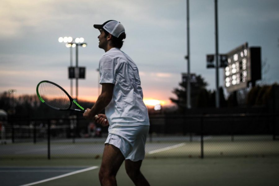 Luciano Tacchi looking off to his teammates’ courts during his singles match against the Davidson Wildcats on Feb. 28 at the Wake Forest Tennis Center.