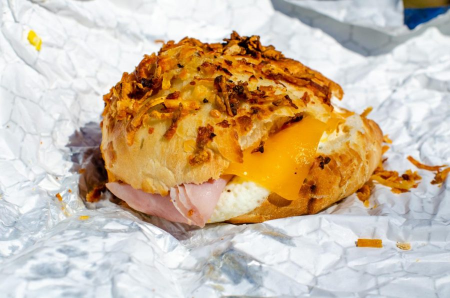 The+farmhouse+bagel+includes+eggs%2C+bacon%2C+ham+and+cheese+on+a+cheesy+hash-brown+bagel.+It+promises+to+satisfy+all+of+your+cravings.