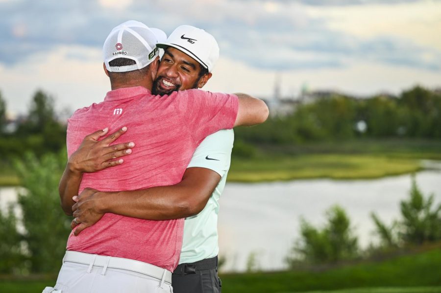 Jon+Rahm+embraces+Finau+after+his+win+in+the+playoff+against+Cameron+Smith.+With+the+third+place+finish%2C+Rahm+moves+to+second+in+the+rankings.+