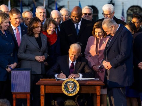 President Biden signs the infrastructure bill into law at the White House on Nov. 15. The bill will introduce sweeping changes to the nations transportation systems. -