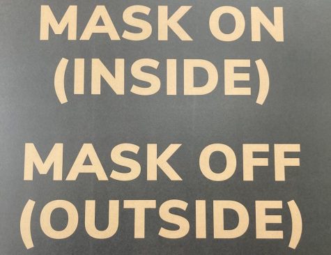 A poster in Benson University Center outlines Wake Forests current masking policy.