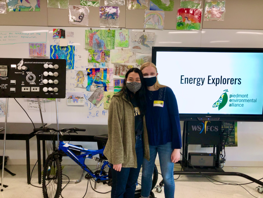 Using Powerpoint and an energy-producing bike, senior Julia McElhinny and sophomore Emy Yamamto visit WSFCS seventh-grade classrooms to talk about sustainability