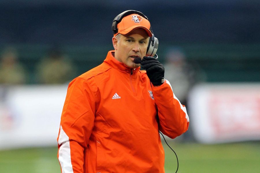 Dave Clawson talks into his headset in full Bowling Green getup.