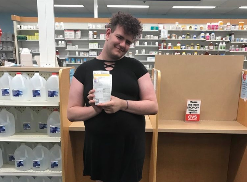 A 16 year-old Aine Pierre poses with her first dose of hormones at CVS.
