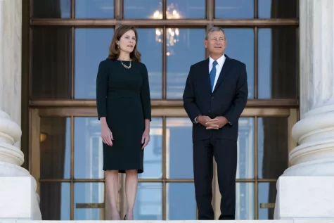Chief Justice John Roberts (right) stands with Justice Amy Coney Barrett (left), who voted to uphold a restrictive Texas abortion law last term.