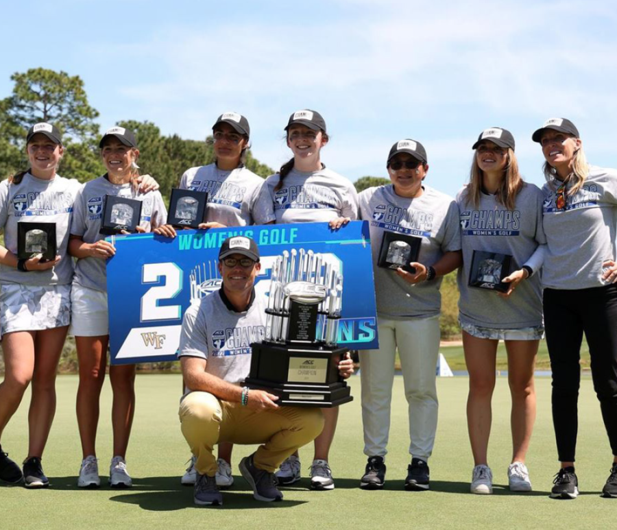 The Wake Forest womens golf team poses with the ACC Championship trophy.