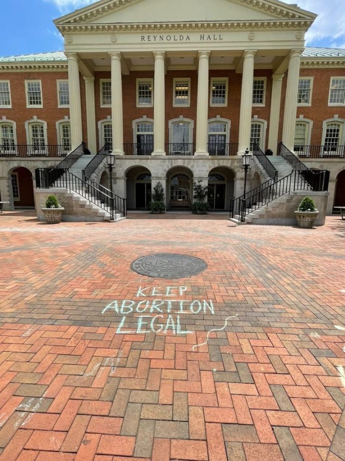Students wrote messages in chalk on Hearn Plaza supporting abortion rights.