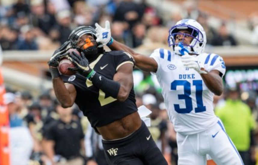 Donald Stewart (left) catches a pass in a home game against Duke.