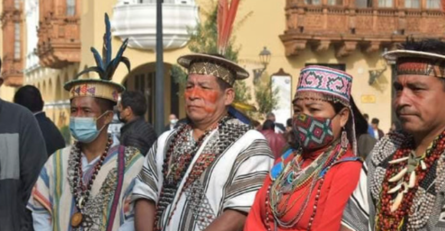 A photograph of four Indigenous leaders in a line