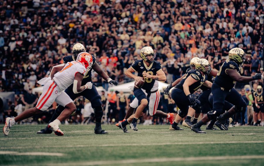 Sam Hartman (No. 10 in black) commands the Wake Forest offense against Clemson. 