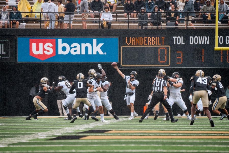 Sam Hartman (No. 10 in white) throws a pass during a 45-25 victory over Vanderbilt.