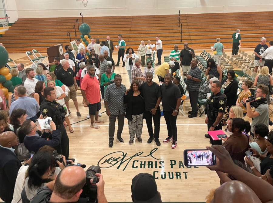 A photograph of a gathering on West Forsyth High Schools basketball court