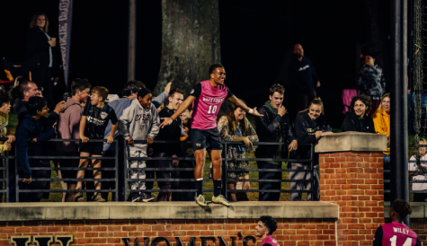 Junior midfielder Oscar Sears (No.10 in pink) celebrates with the crowd after scoring his second goal on the night against Boston College.