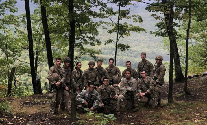 Army Mountain Warfare School participants gather together for a photo after a day full of training and tests.