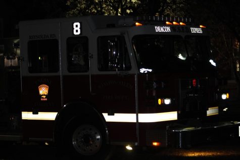 A firetruck arrives at Reynolda Hall to extinguish the fire.