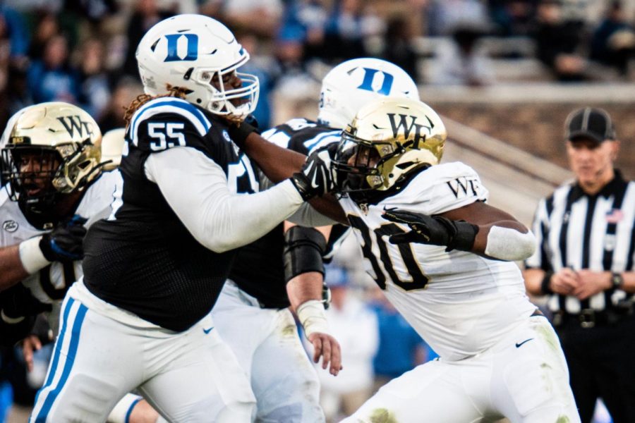 Wake Forests defensive line tries to break through to the Duke quarterback.
