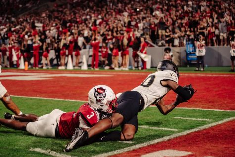 An NC State defender takes down Jahmal Banks (in white) just short of the end zone. Wake Forest did not score on this possession.