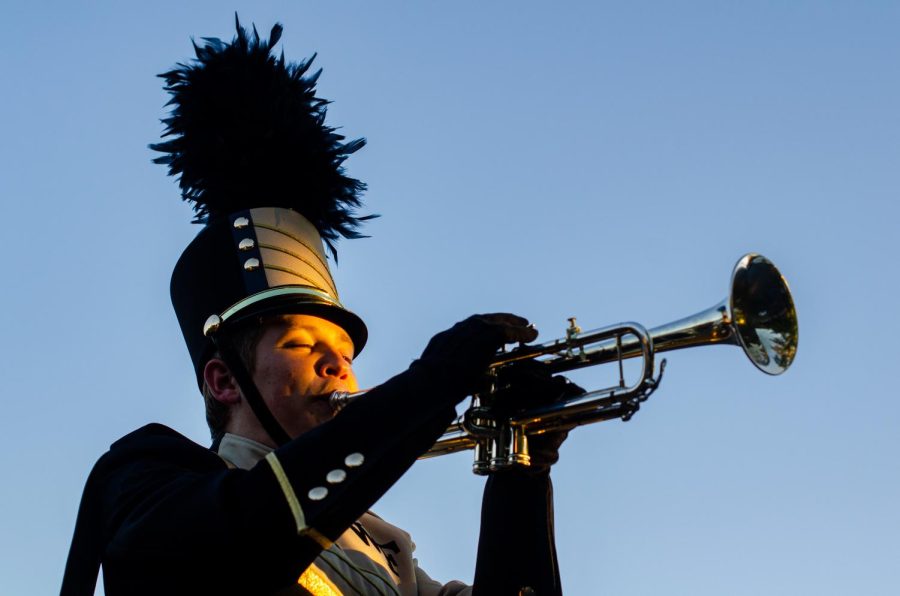 Finnegan Siemion plays his trumpet at a Wake Forest football game.