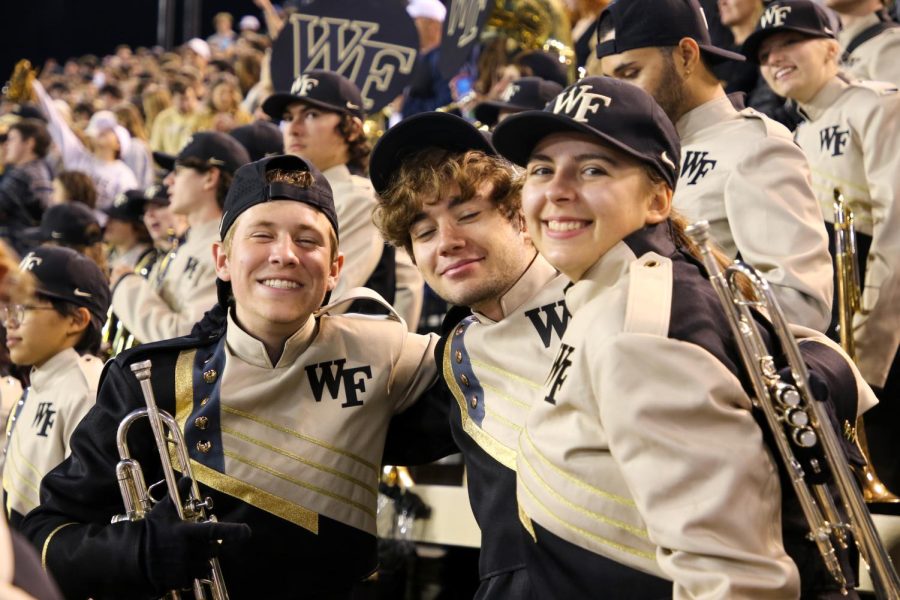 Finnegan Siemion poses with his friends in the marching band during the Army game.