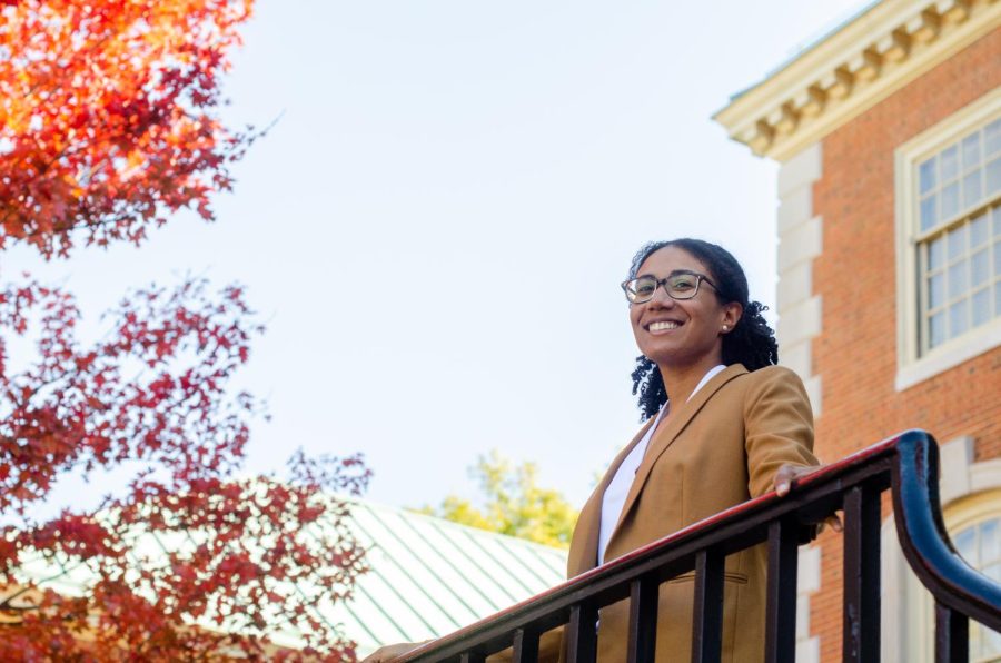 Dr. Lauren Lowman, who runs the Environmental Dynamics Lab, poses in front of Reynolda Hall.