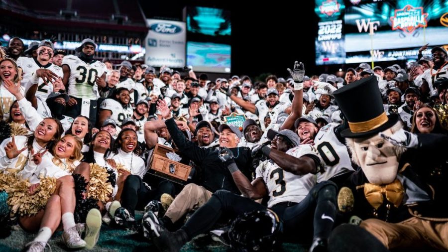 The Demon Deacons celebrate at midfield after winning the Gasparilla Bowl.