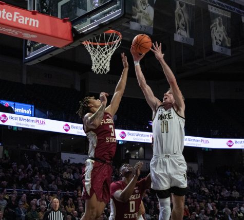  Andrew Carr goes for the contested layup against Florida State’s Cameron Corhen. The junior forward finished the night with 22 points and four rebounds.

