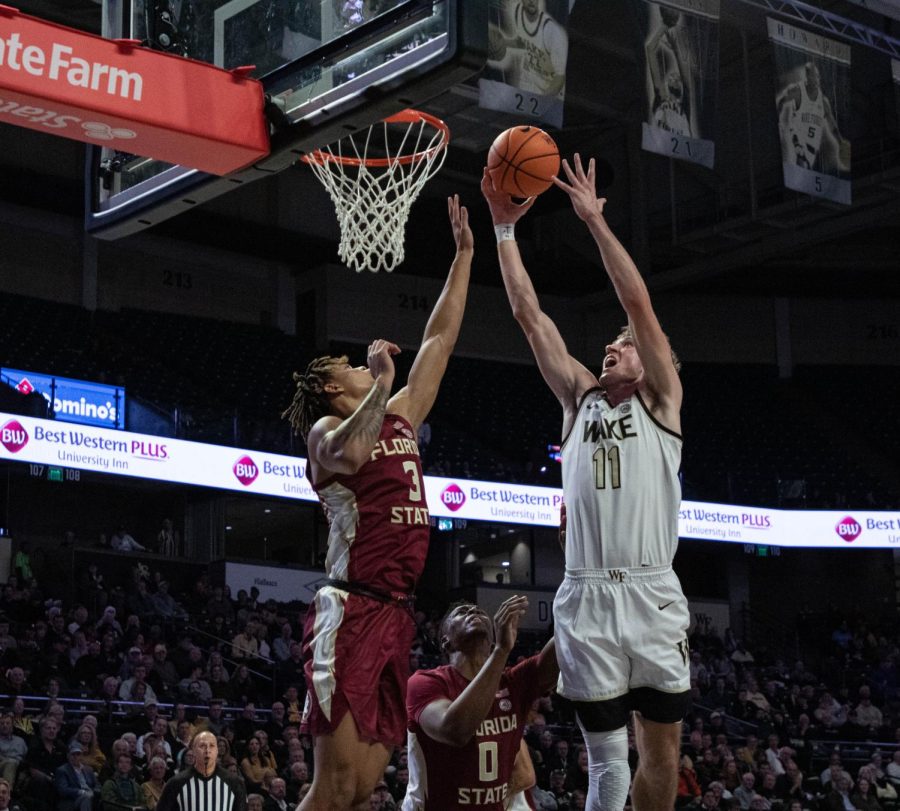 +Andrew+Carr+goes+for+the+contested+layup+against+Florida+State%E2%80%99s+Cameron+Corhen.+The+junior+forward+finished+the+night+with+22+points+and+four+rebounds.%0A