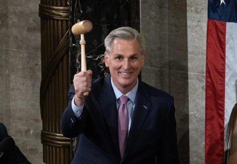 Kevin McCarthy holds the Speakers gavel after winning election on the 15th ballot.